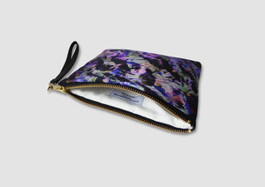 Purple and black clutch bag with wrist strap
